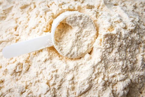 Plastic spoon in protein powder Plastic spoon in protein powder